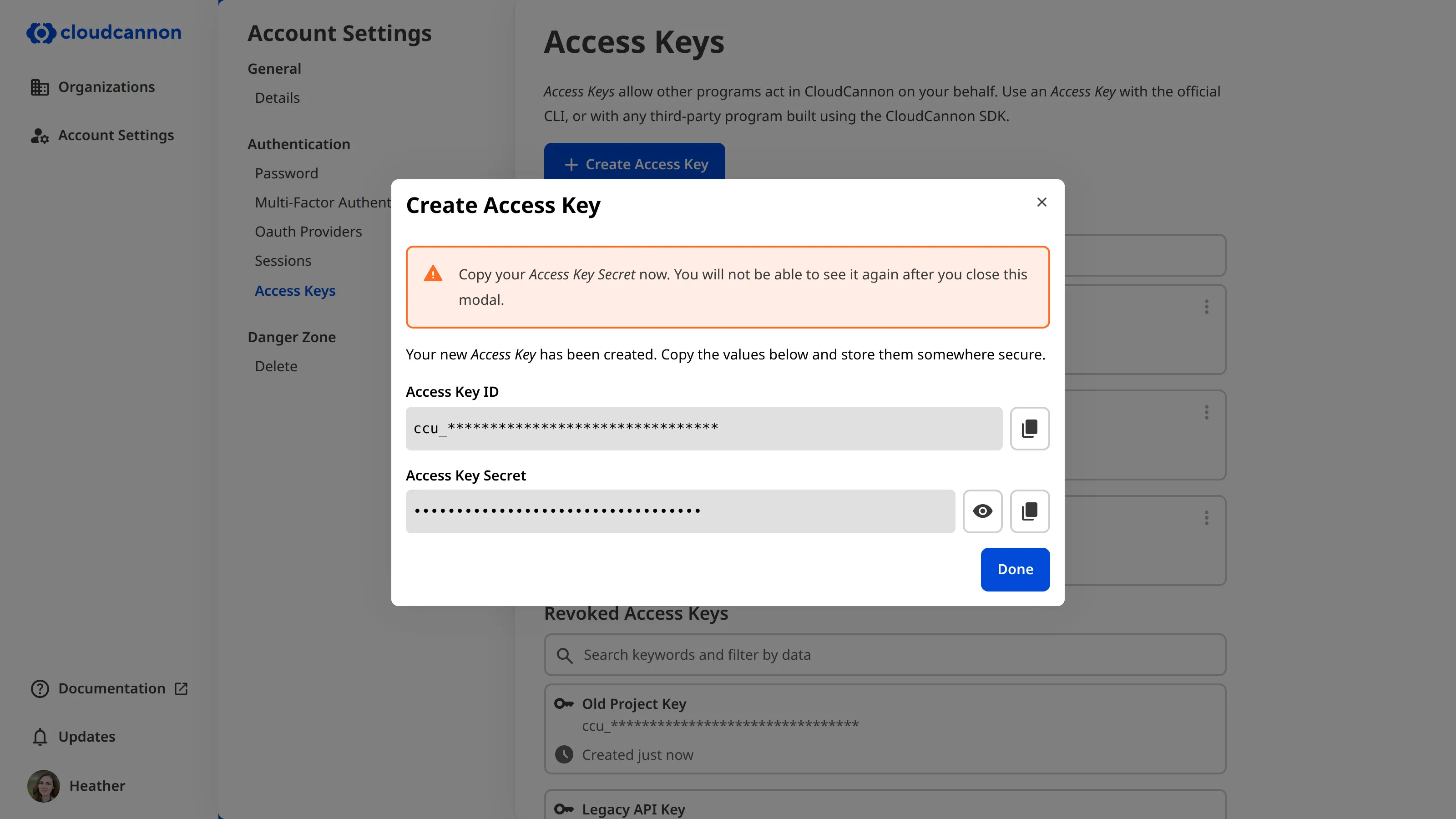 A newly created Access Key A screenshot of the Create Access Key modal shows the generated Access Key ID and a masked Access Key Secret, each with a copy button, above the Done button.
