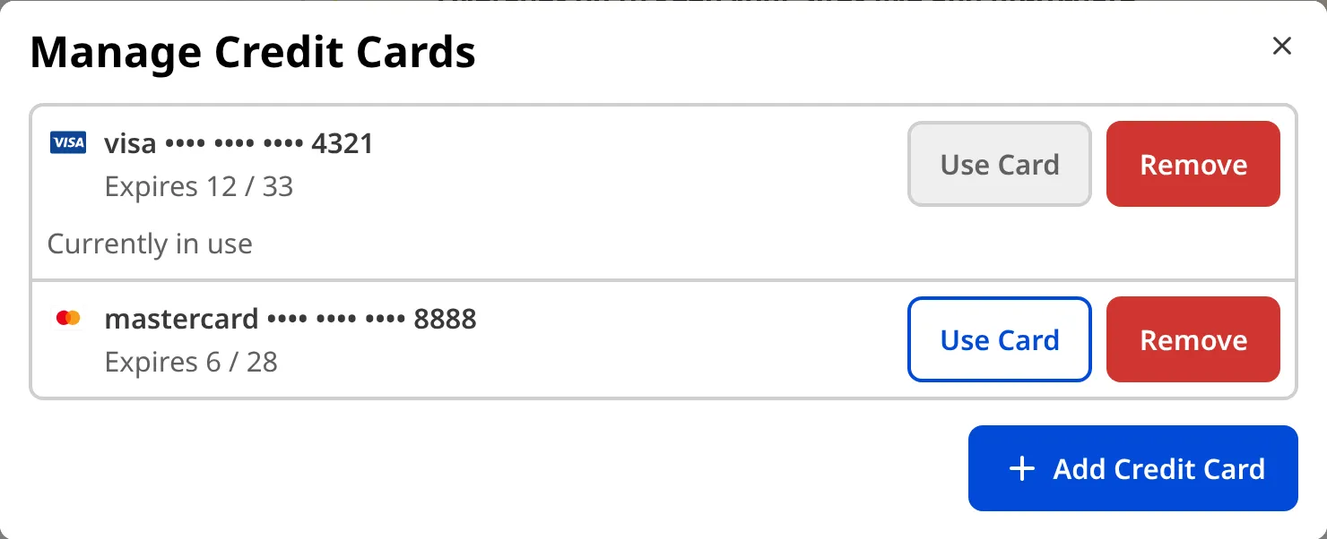 The Manage Credit Cards modal A screenshot of the Manage Credit Cards modal in CloudCannon, showing two saved cards, one currently in use and one with a Use Card option, each with a Remove option, and an Add Credit Card button.