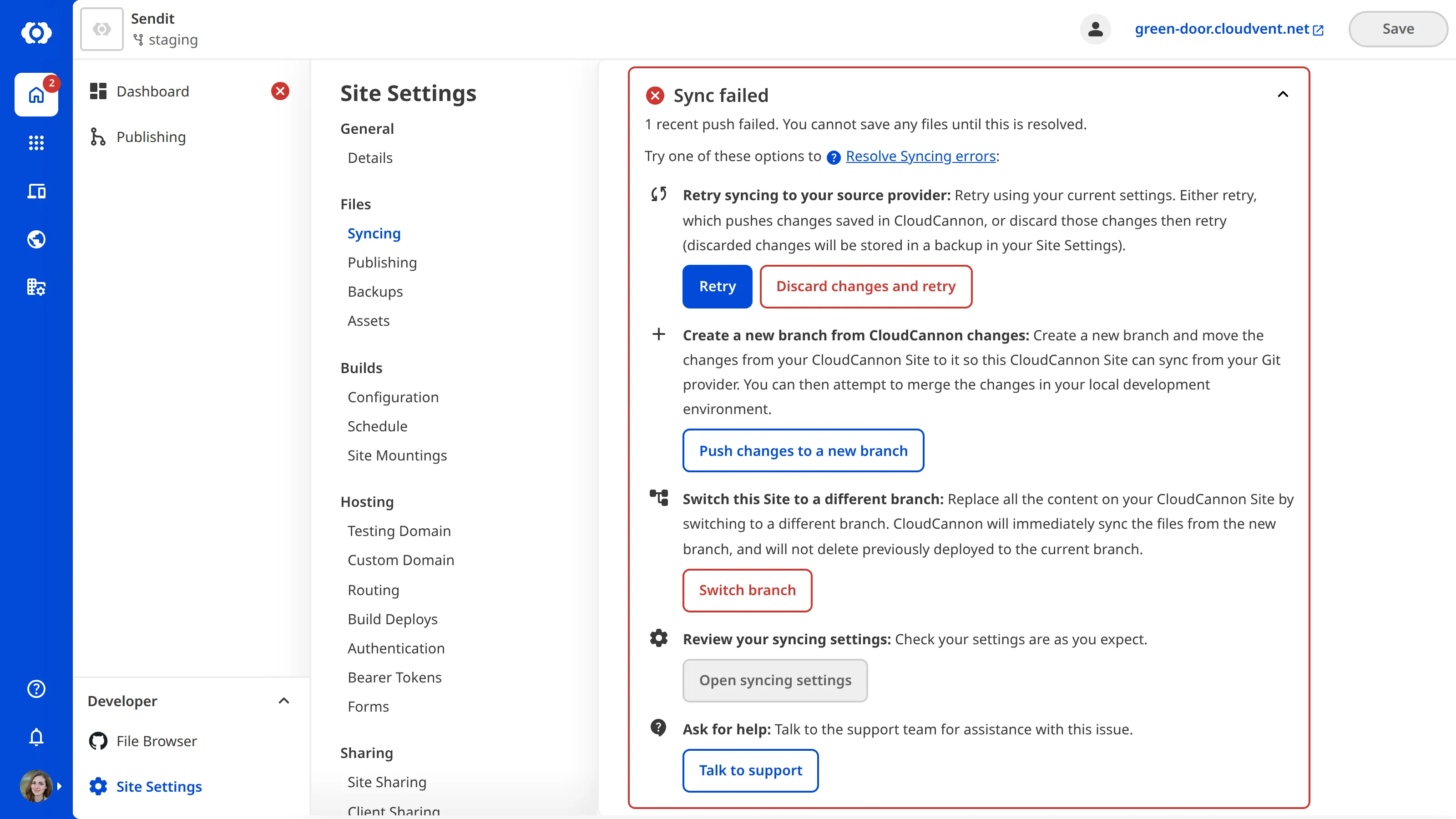 A screenshot of the Syncing page shows resolution options for a sync conflict, including creating a new branch, resetting from the Git repository, and switching to a different branch.