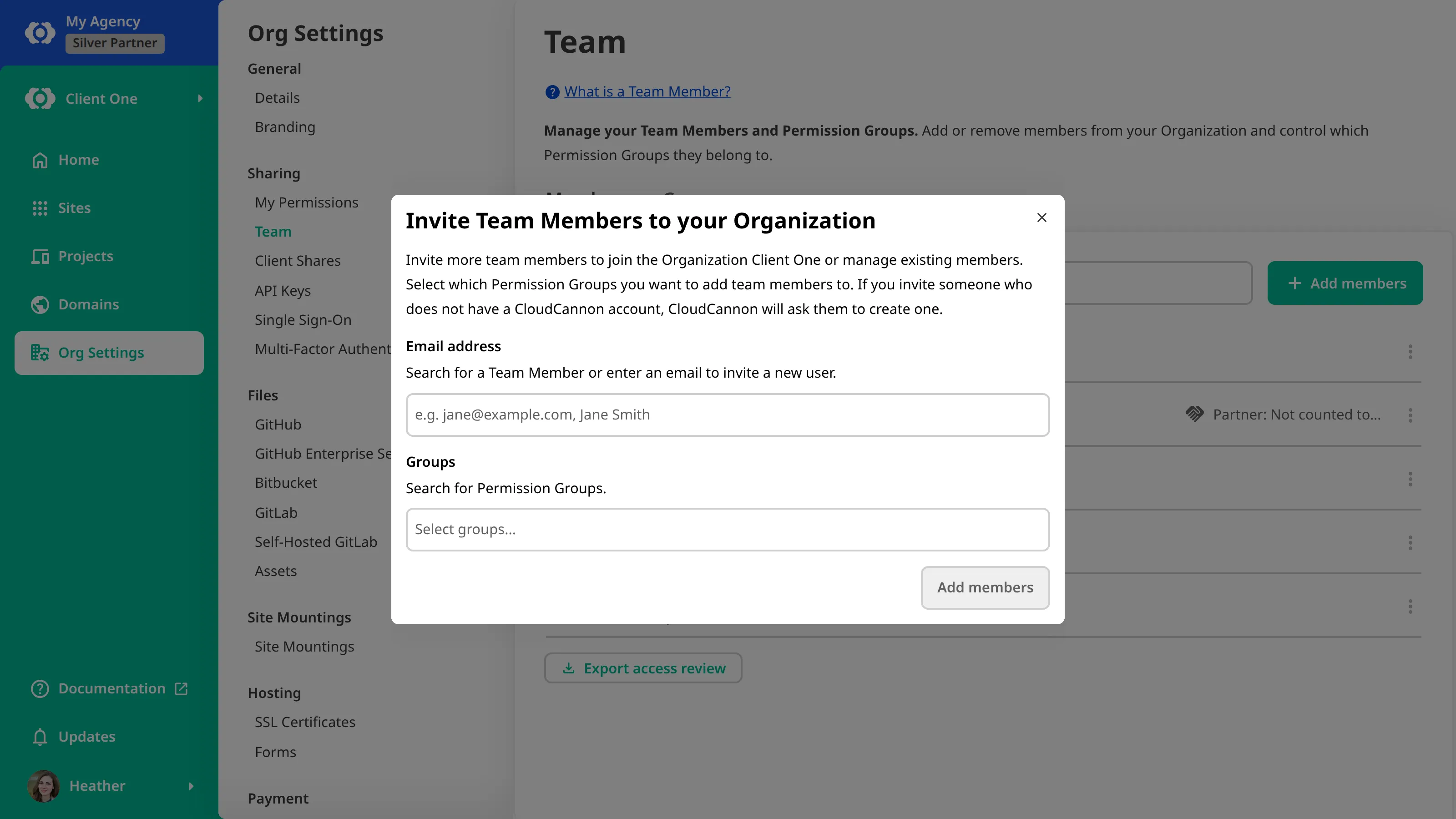 A screenshot of the Invite Team Members modal in a Client Organization shows fields for an email address and a Permission Group, above the Add members button.