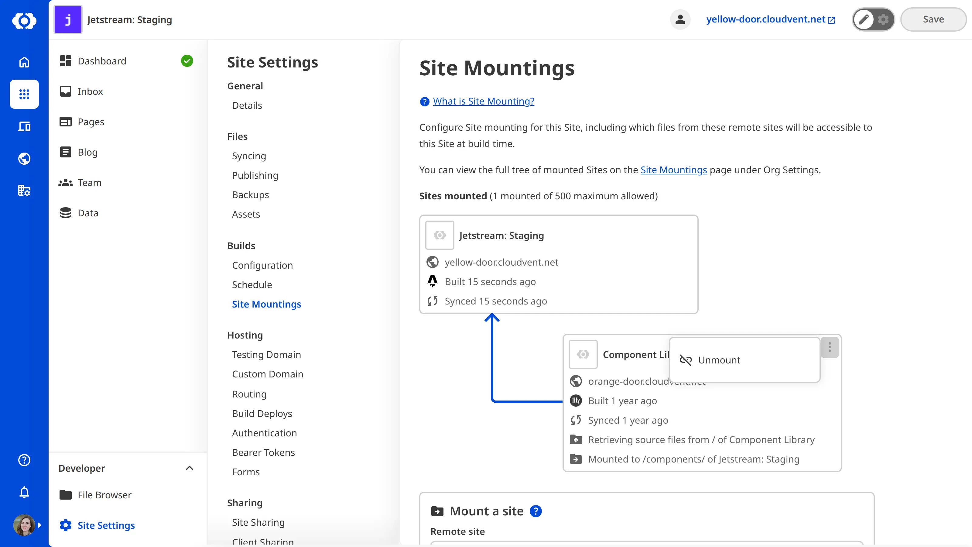 A screenshot of the Site Mountings page showing a mounted site with the context menu open, displaying the Unmount option.