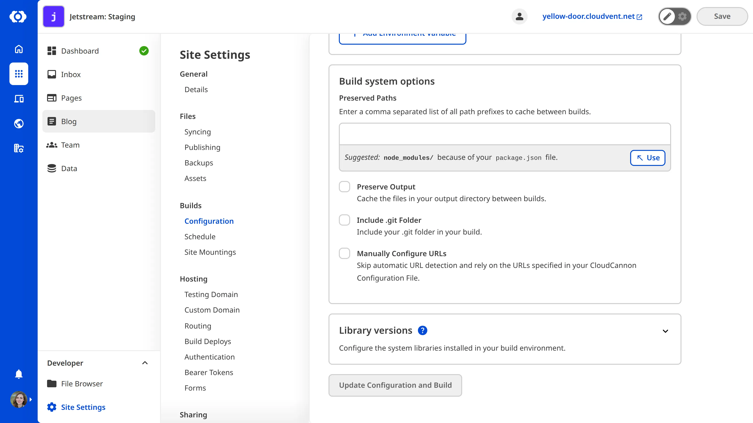 The Build Configuration page scrolled to the Build system options section, showing the Manually Configure URLs checkbox.