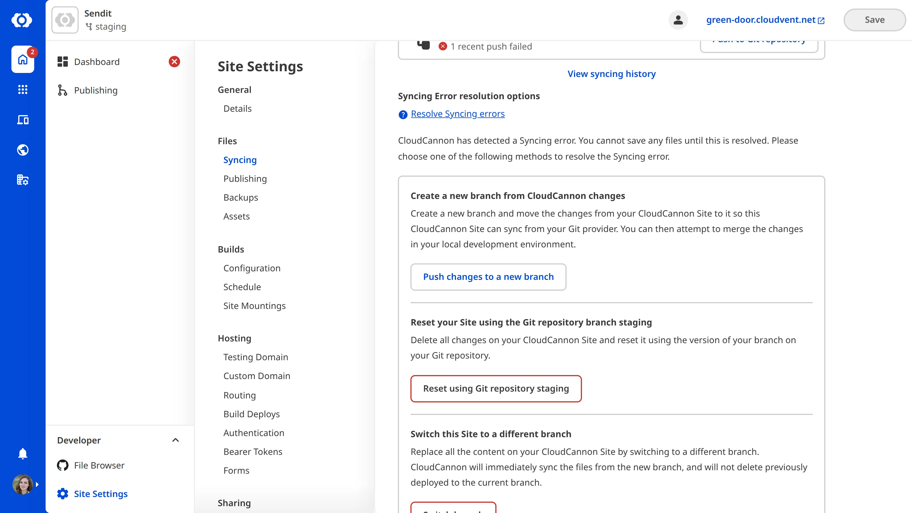A screenshot of the Syncing page shows resolution options for a sync conflict, including creating a new branch, resetting from the Git repository, and switching to a different branch.
