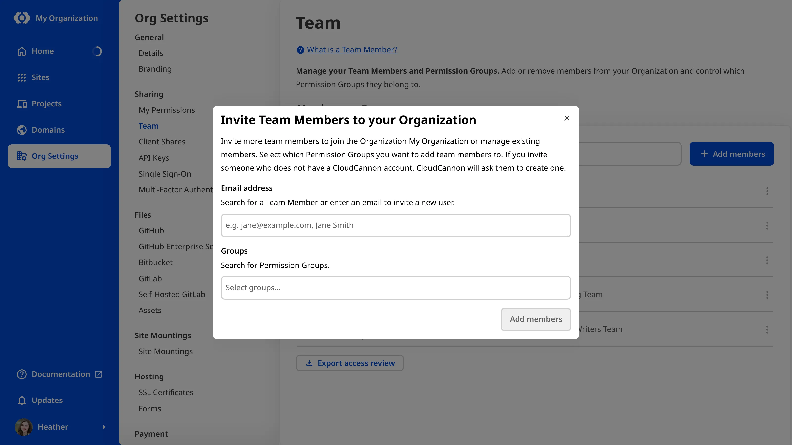 A screenshot of the Invite team members to your Organization modal shows fields for entering email addresses and selecting Permission Groups.