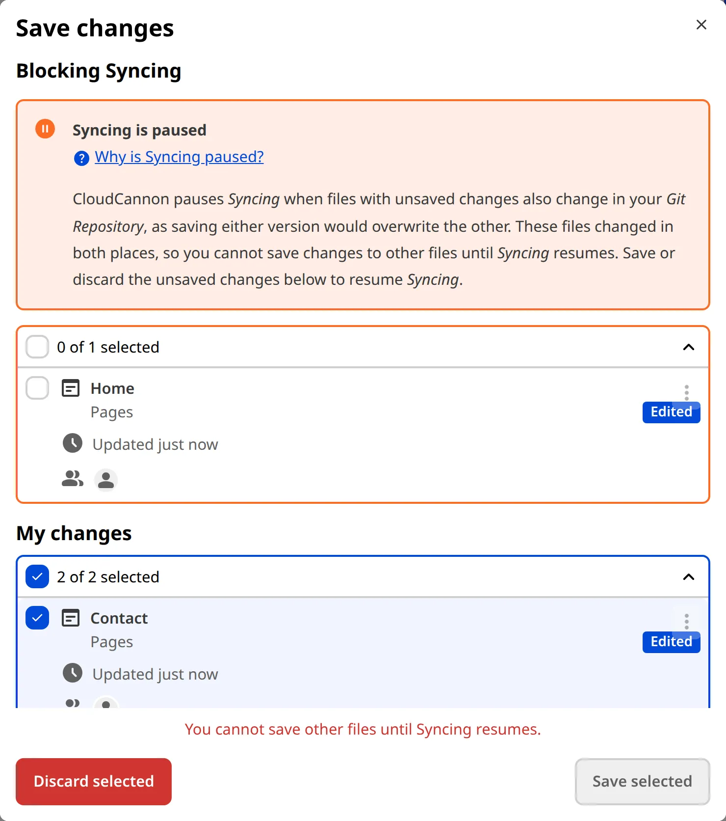 The Review Changes modal The Review changes modal shows the Needs attention heading with a Syncing is paused warning and an affected file.