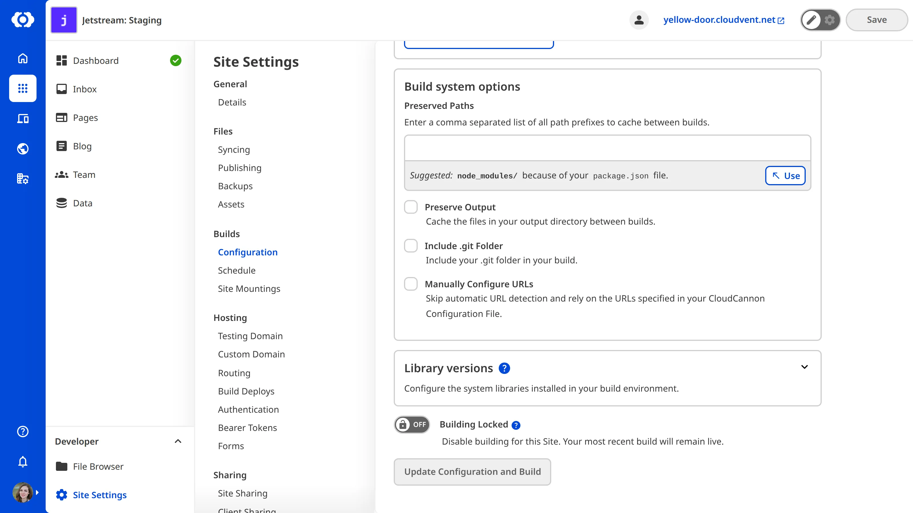 The Build Configuration page scrolled to the Build system options section, showing the Manually Configure URLs checkbox.