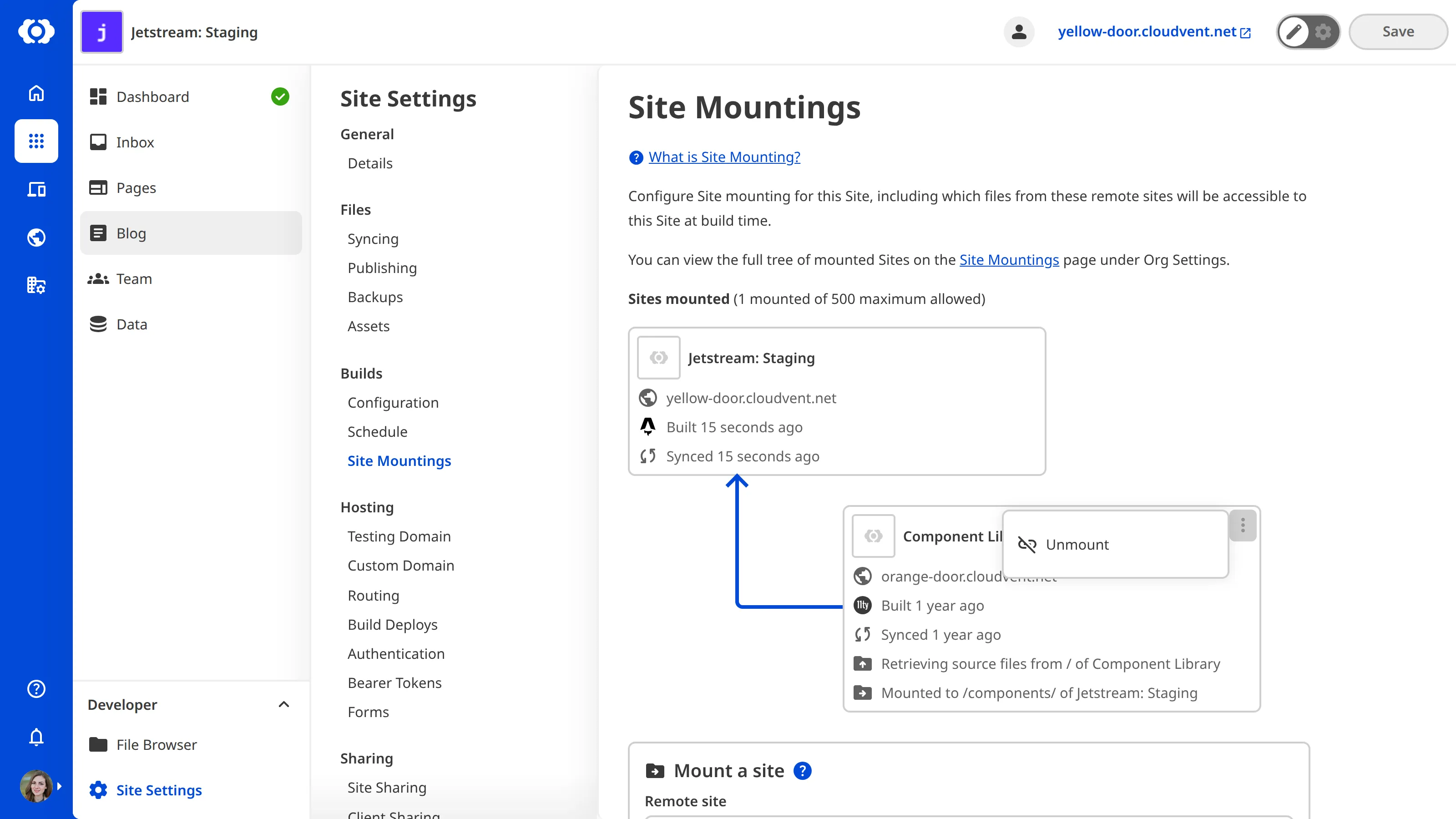 A screenshot of the Site Mountings page showing a mounted site with the context menu open, displaying the Unmount option.